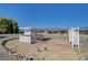 Exterior shot of a pergola with brick pavers, set amongst tranquil surroundings and landscaping at 1450 Fern St, Pahrump, NV 89060