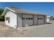 Garage exterior featuring two-car garage, siding, and simple architectural details at 1450 Fern St, Pahrump, NV 89060