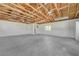 Spacious garage interior with high ceilings and exposed wooden rafters at 1450 Fern St, Pahrump, NV 89060