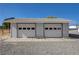 Detached garage with two bays, concrete pad, and ample parking space at 1450 Fern St, Pahrump, NV 89060