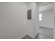 Hallway showing an electrical panel; bedroom with a window visible in the background at 1450 Fern St, Pahrump, NV 89060