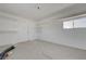 Unfinished interior with built-in shelving, providing an adaptable space with storage under bright lighting at 1450 Fern St, Pahrump, NV 89060