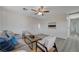 Cozy living room with plenty of seating space, natural light and ceiling fan at 1450 Fern St, Pahrump, NV 89060