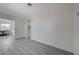 A bright living room with wood floors leading into dining area at 1450 Fern St, Pahrump, NV 89060