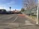 Community basketball court with trees and buildings in the background at 1455 E Katie Ave # L23, Las Vegas, NV 89119