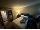 A cozy bedroom features soft lighting, a comfortable bed, and a functional workspace at 1455 E Katie Ave # L23, Las Vegas, NV 89119