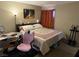 Bright bedroom with stylish decor and ample space for a comfortable living at 1455 E Katie Ave # L23, Las Vegas, NV 89119