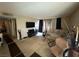 Inviting living room featuring plush carpet and a large window for natural light at 1455 E Katie Ave # L23, Las Vegas, NV 89119