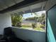 A cozy patio with a view of the community tennis court and green space at 1455 E Katie Ave # L23, Las Vegas, NV 89119