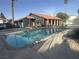 Large community pool with several chairs in the pool area at 1455 E Katie Ave # L23, Las Vegas, NV 89119