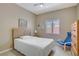 Cozy bedroom with a comfortable bed, dresser, and a window, creating a relaxing and private retreat at 1766 Baja Ln, Henderson, NV 89012
