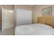 Cozy bedroom featuring neutral tones, a sliding closet, and comfortable bed with bright natural lighting at 1766 Baja Ln, Henderson, NV 89012