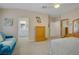 Spacious bedroom featuring a ceiling fan, an ensuite bathroom, a closet, and bright natural lighting at 1766 Baja Ln, Henderson, NV 89012