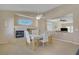 Elegant dining area with a fireplace and seamless flow into the living space at 1766 Baja Ln, Henderson, NV 89012