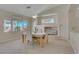 Bright dining room features a fireplace, large windows, and neutral décor at 1766 Baja Ln, Henderson, NV 89012