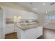 Well-lit kitchen with granite counters, white cabinetry, and stainless steel appliances offering both style and functionality at 1766 Baja Ln, Henderson, NV 89012