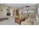 Open-concept living room with comfortable sofas, a rocking chair, and easy access to other rooms at 1766 Baja Ln, Henderson, NV 89012