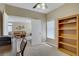 Bright office space with a desk, shelving, and view into the adjacent living area at 1766 Baja Ln, Henderson, NV 89012