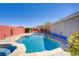 Sparkling pool with a jacuzzi and desert landscaping, perfect for backyard relaxation and fun at 1766 Baja Ln, Henderson, NV 89012