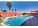 Backyard pool and spa featuring lush landscaping and a brick privacy wall for a secluded outdoor oasis at 1766 Baja Ln, Henderson, NV 89012