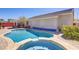 Backyard pool and hot tub, with brick patio, in a desert-landscaped yard at 1766 Baja Ln, Henderson, NV 89012