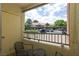Comfortable balcony area with seating and view of the community parking and surrounding buildings at 2120 Ramrod Ave # 513, Henderson, NV 89014