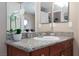 Granite countertop bathroom featuring a well lit mirror at 2120 Ramrod Ave # 513, Henderson, NV 89014