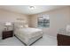 Cozy bedroom with a Queen-size bed, neutral decor, and natural light from the window at 2120 Ramrod Ave # 513, Henderson, NV 89014