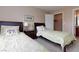 Inviting bedroom showcasing two beds, a nightstand with a lamp, and a glimpse into the closet and bathroom at 2120 Ramrod Ave # 513, Henderson, NV 89014