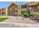 Stylish apartment building featuring a landscaped yard, covered patios, and convenient access to outdoor stairs at 2120 Ramrod Ave # 513, Henderson, NV 89014