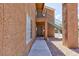 Exterior view of a condo building with private entrance and staircase leading to upper-level units at 2120 Ramrod Ave # 513, Henderson, NV 89014