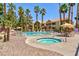 Enjoy the luxurious spa and sparkling pool surrounded by palm trees for relaxation and recreation at 2120 Ramrod Ave # 513, Henderson, NV 89014