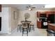 Cozy dining area featuring a round table with seating for four and a stylish ceiling fan at 2120 Ramrod Ave # 513, Henderson, NV 89014
