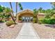 Well-maintained fitness center entrance surrounded by palm trees and landscaping at 2120 Ramrod Ave # 513, Henderson, NV 89014