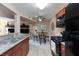 Modern kitchen featuring stainless steel appliances, granite countertops, and ample cabinet space at 2120 Ramrod Ave # 513, Henderson, NV 89014
