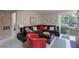 Comfortable living room with a brown sectional sofa, bright accent chair, and sliding glass doors to a balcony at 2120 Ramrod Ave # 513, Henderson, NV 89014