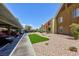 Exterior view of the condo buildings with assigned carport parking and landscaped common area at 2120 Ramrod Ave # 513, Henderson, NV 89014