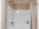 Shower featuring white tiled walls and modern fixtures at 2120 Ramrod Ave # 513, Henderson, NV 89014
