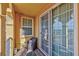 Inviting balcony with seating area, sliding glass doors, and window offering natural light and outdoor access at 2405 W Serene Ave # 703, Las Vegas, NV 89123