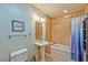 Bathroom featuring tiled shower, pedestal sink, and modern fixtures at 2405 W Serene Ave # 703, Las Vegas, NV 89123