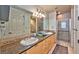 Spacious bathroom with granite countertops, dual sinks, and glass enclosed shower at 2405 W Serene Ave # 703, Las Vegas, NV 89123