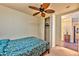 Cozy bedroom featuring a comfortable bed, ceiling fan, and closet space at 2405 W Serene Ave # 703, Las Vegas, NV 89123