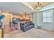 Comfortable living room area with stylish lighting, kitchen access, and cozy couch at 2405 W Serene Ave # 703, Las Vegas, NV 89123