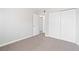 Bedroom featuring a double-door closet and neutral carpet at 2750 S Durango Dr # 2061, Las Vegas, NV 89117