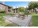 Exterior view of the building with picnic tables and landscaping, perfect for relaxing outdoors at 2750 S Durango Dr # 2061, Las Vegas, NV 89117