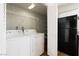 Convenient laundry area including washer, dryer, and storage shelves at 2750 S Durango Dr # 2061, Las Vegas, NV 89117