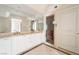 Elegant bathroom featuring dual sinks, marble countertops, and a glass-enclosed shower at 2877 Paradise Rd # 1806, Las Vegas, NV 89109