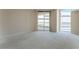 Cozy carpeted bedroom with two large windows offering plenty of natural light at 2877 Paradise Rd # 1806, Las Vegas, NV 89109