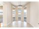 Bright dining area featuring tile floors, a modern chandelier, and ample natural light at 2877 Paradise Rd # 1806, Las Vegas, NV 89109