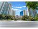 Community entrance with manicured landscaping and several high-rise condominium buildings at 2877 Paradise Rd # 1806, Las Vegas, NV 89109